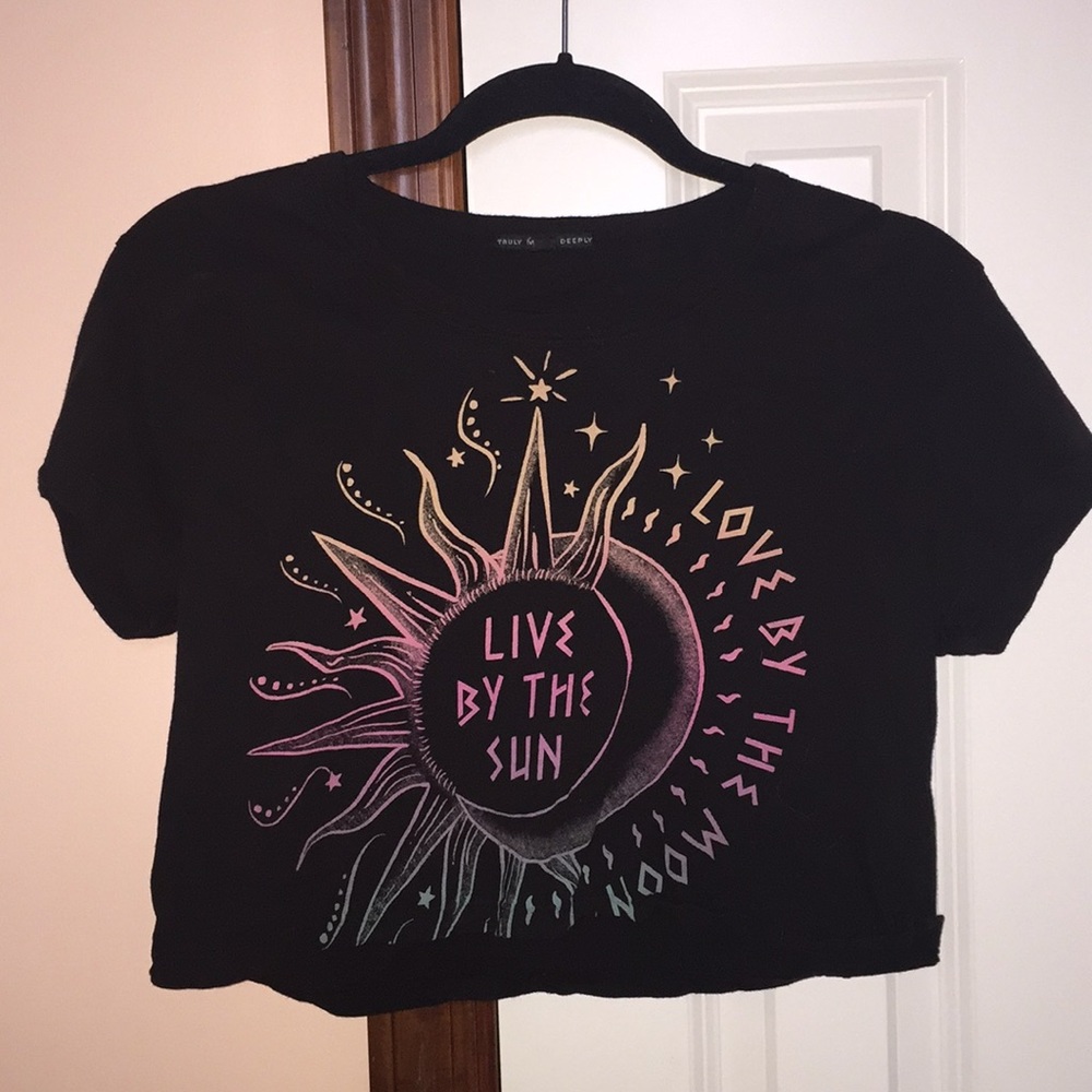 Black short sleeved crop top with graphic details.